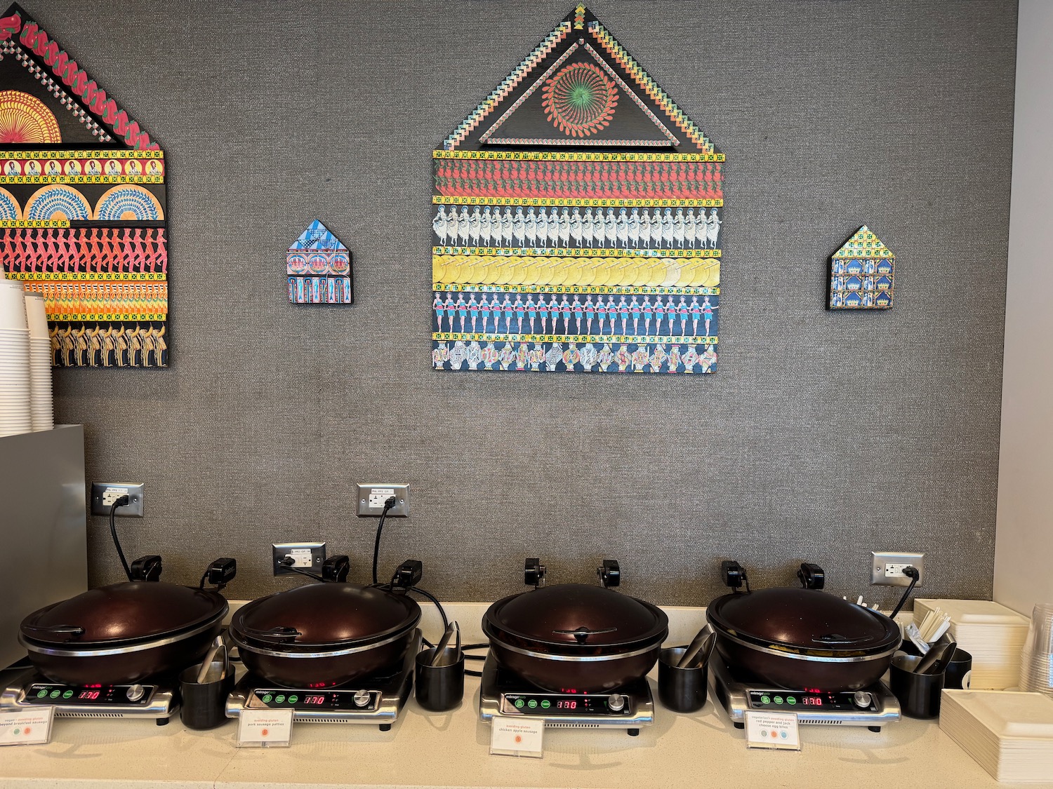 a row of pots on a counter