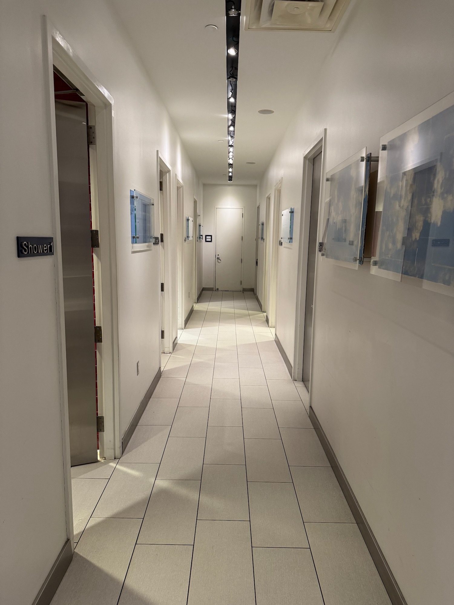 a hallway with white walls and doors