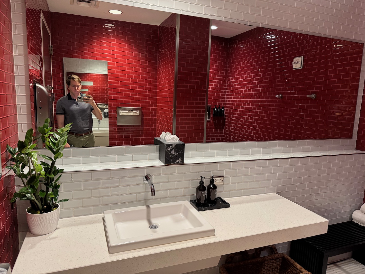 a man taking a selfie in a bathroom