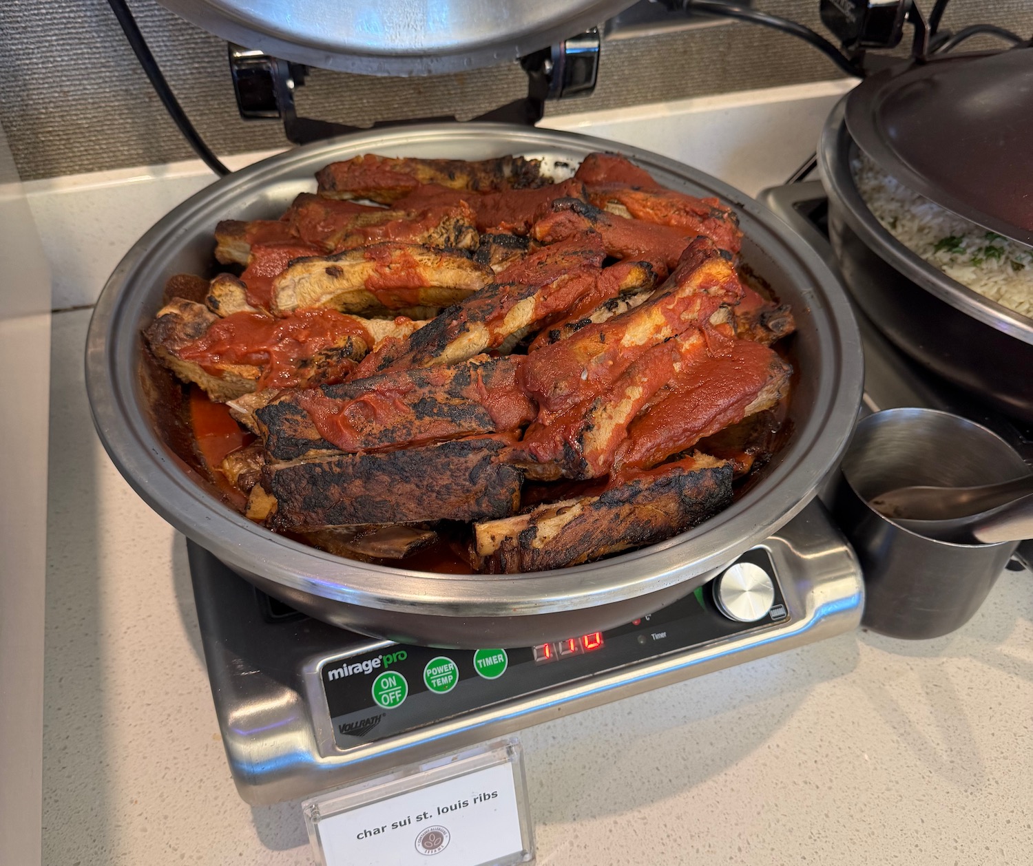 a bowl of ribs on a scale