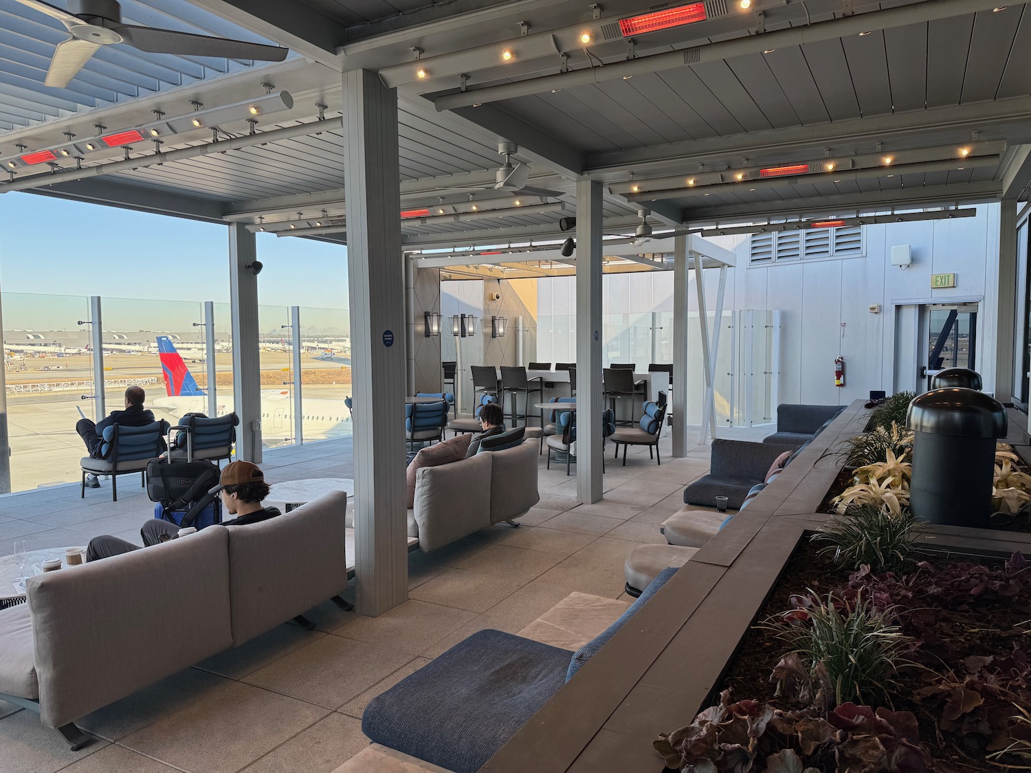 a group of people sitting on a patio