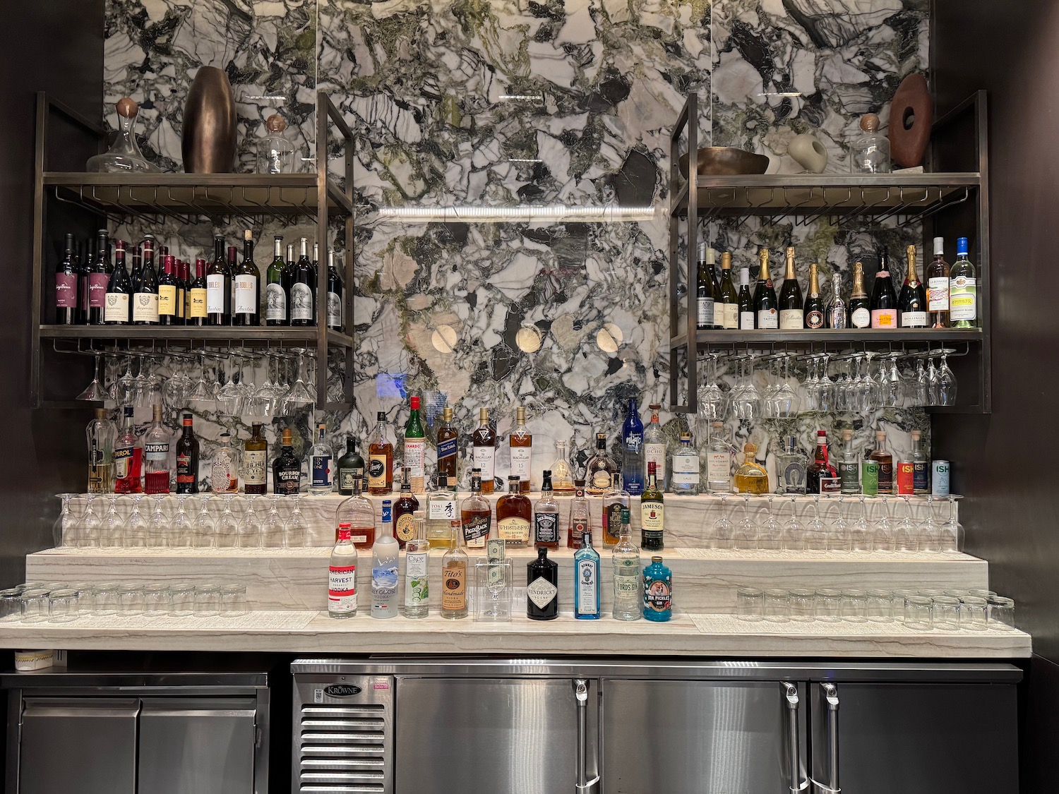 a bar with bottles and glasses