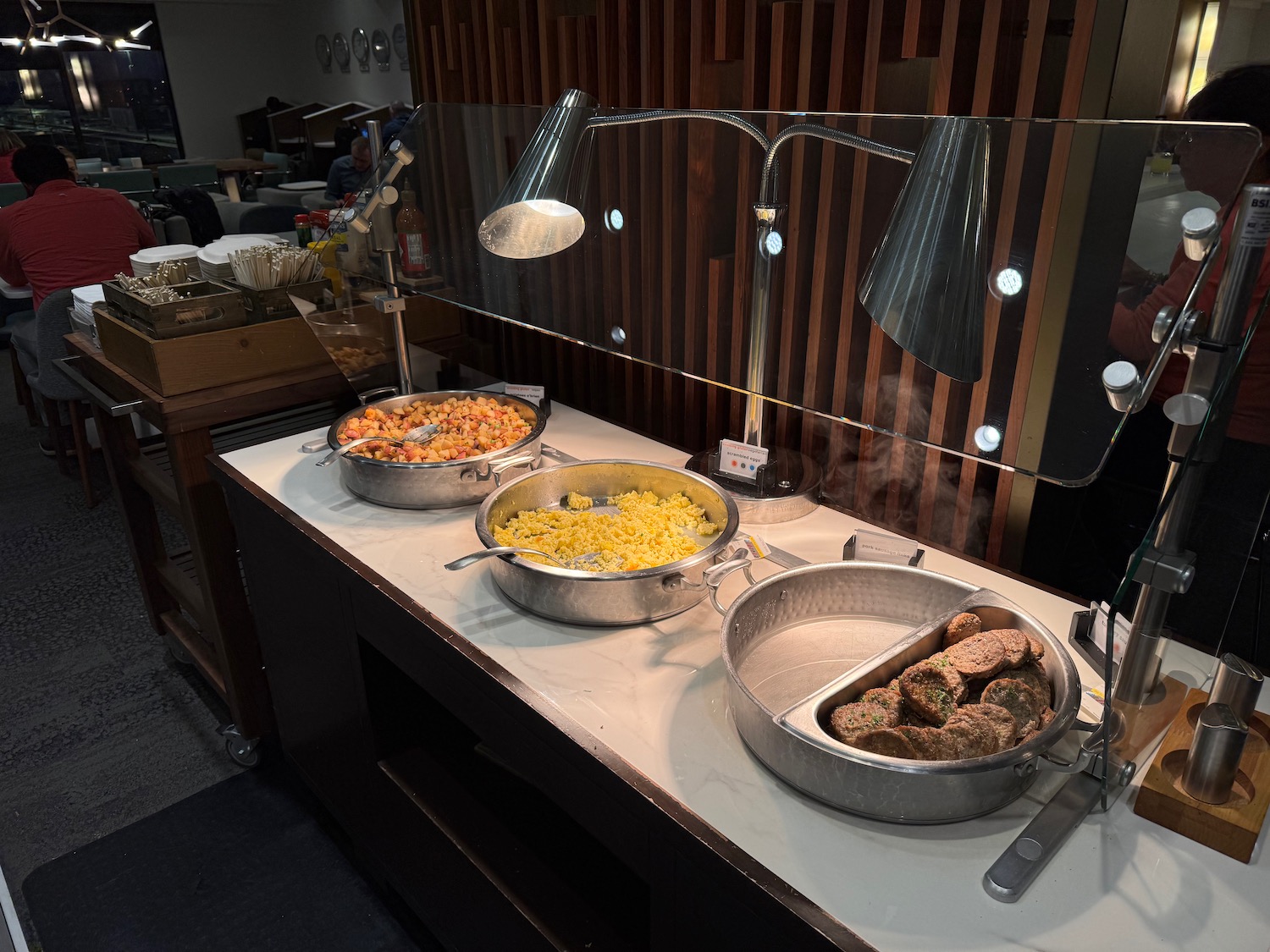 a buffet table with food in pans