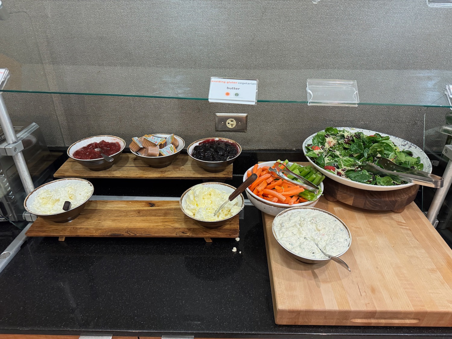 a buffet table with bowls of food