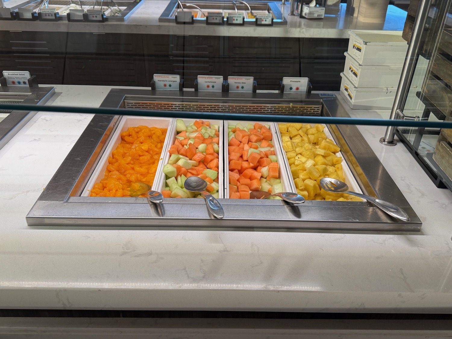 a trays of fruit in a buffet