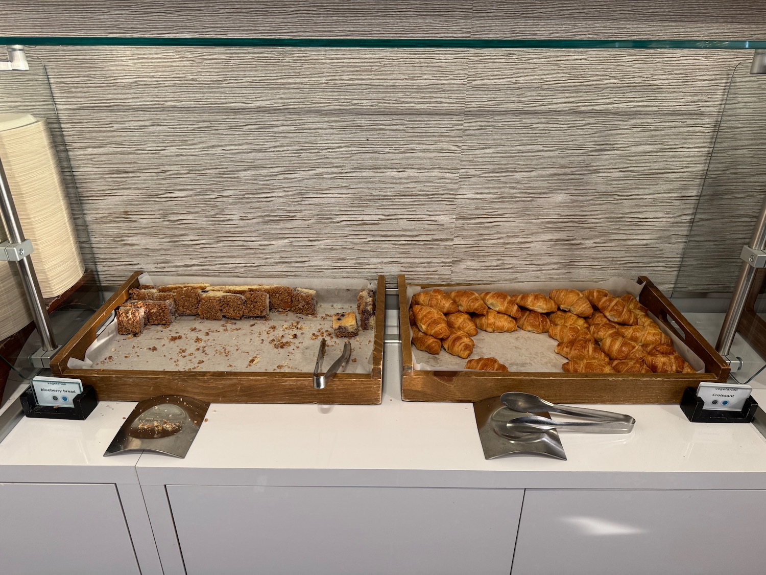 two boxes of croissants on a counter