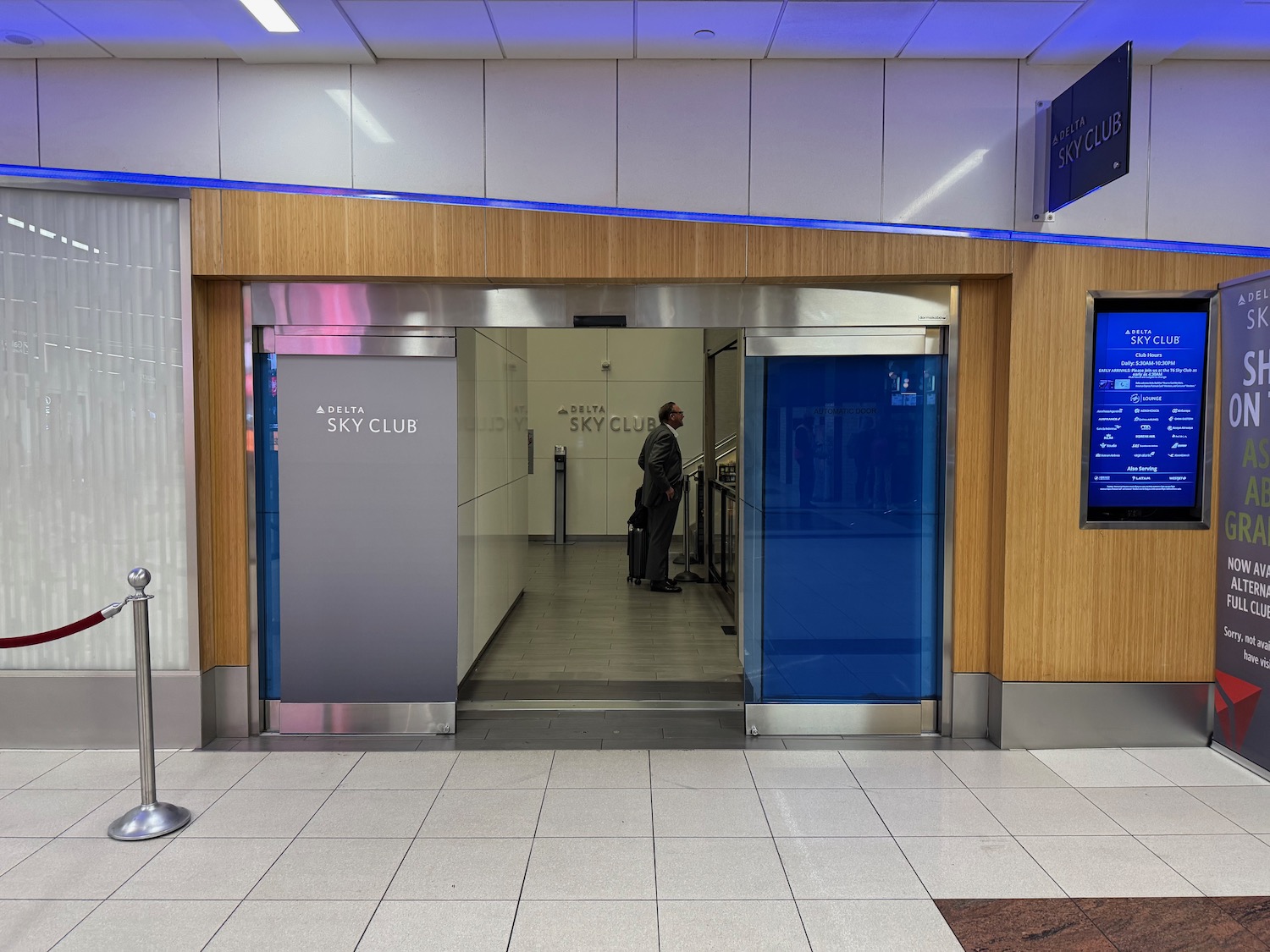 a man standing in front of an elevator