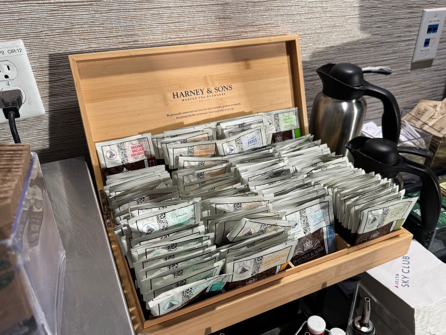 a wooden box with packets of tea in it