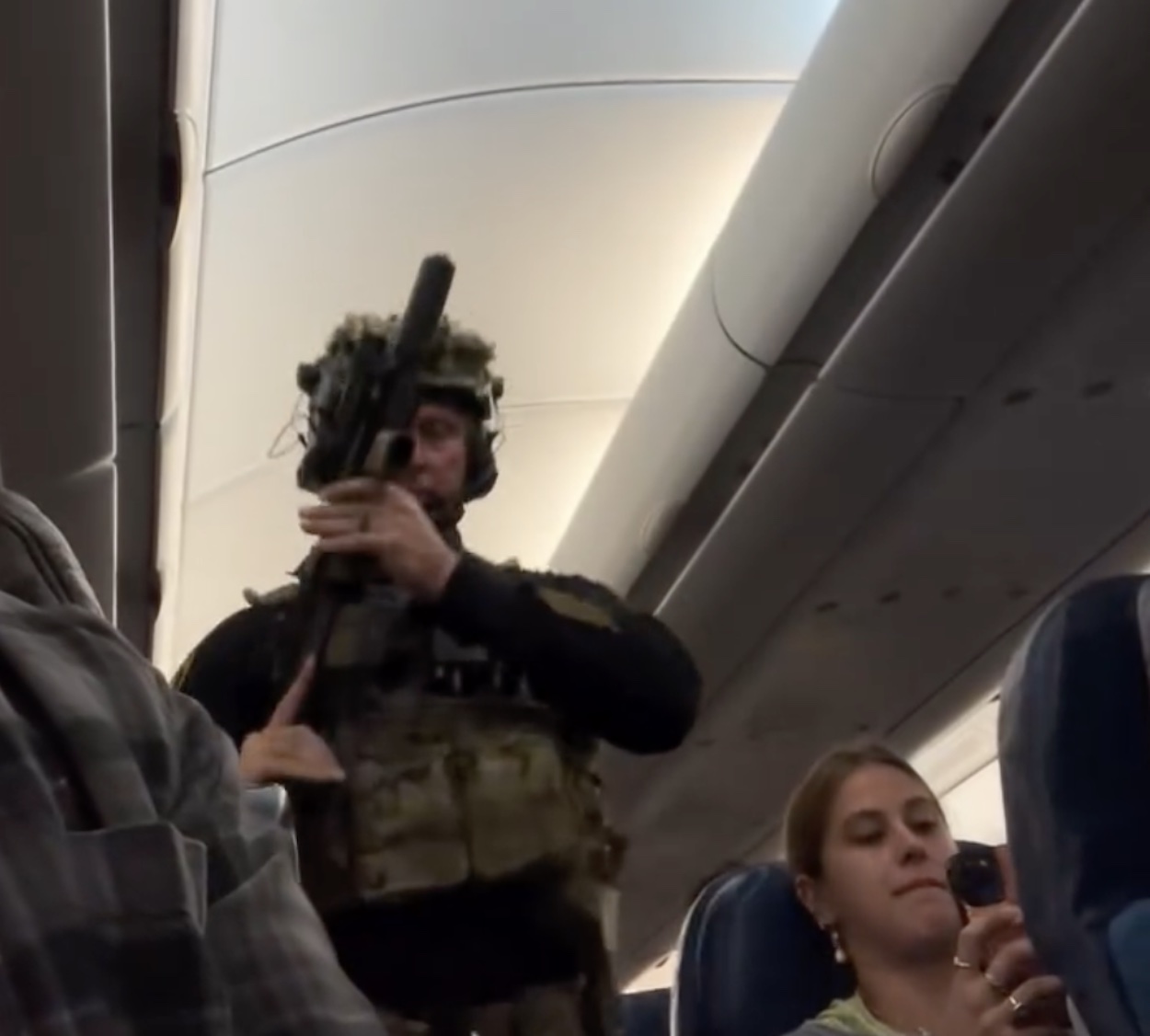 a man in uniform holding a gun