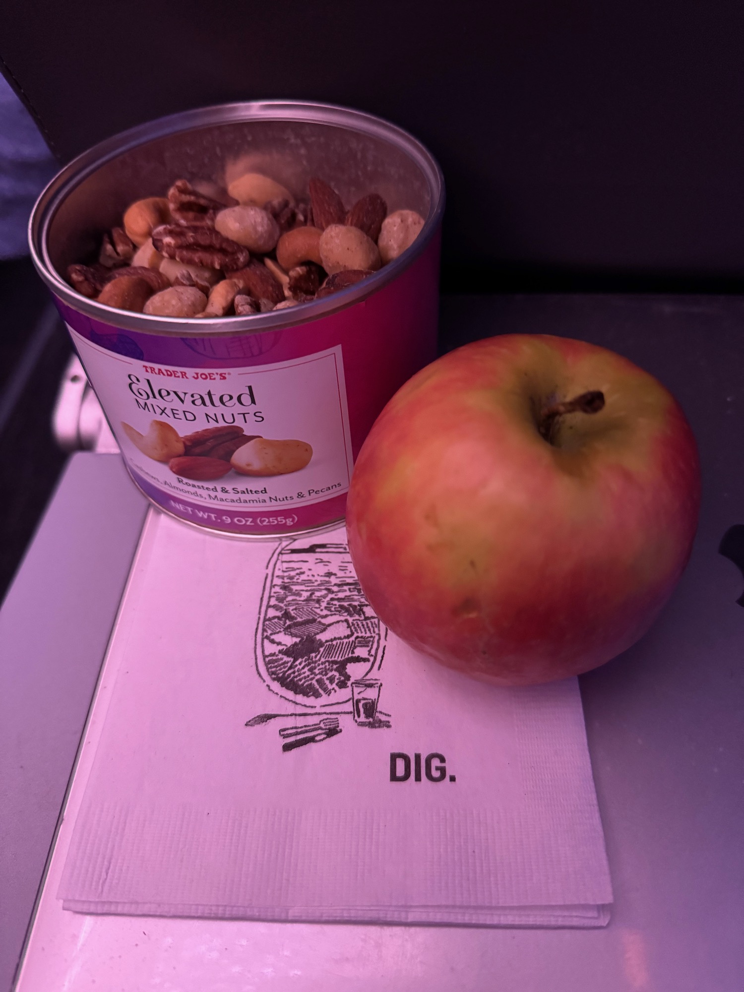 a can of nuts and an apple