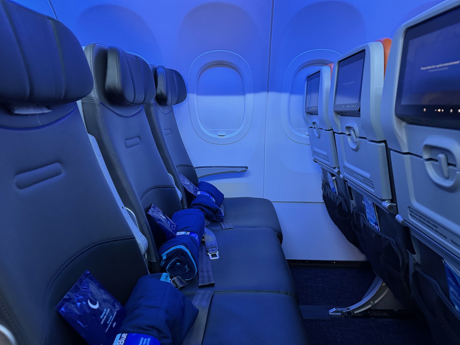 seats in an airplane with seats and windows