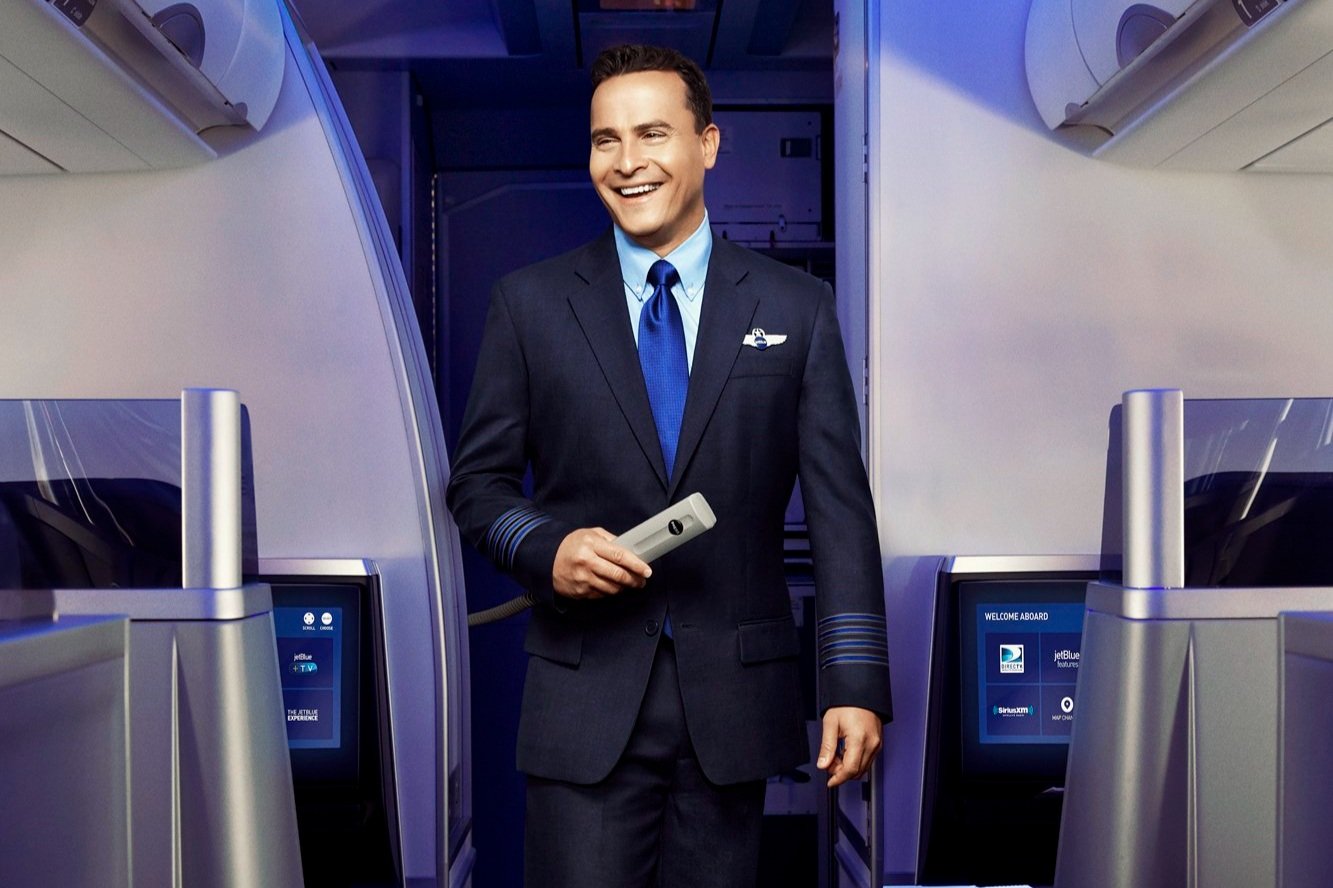 a man in a suit holding a device