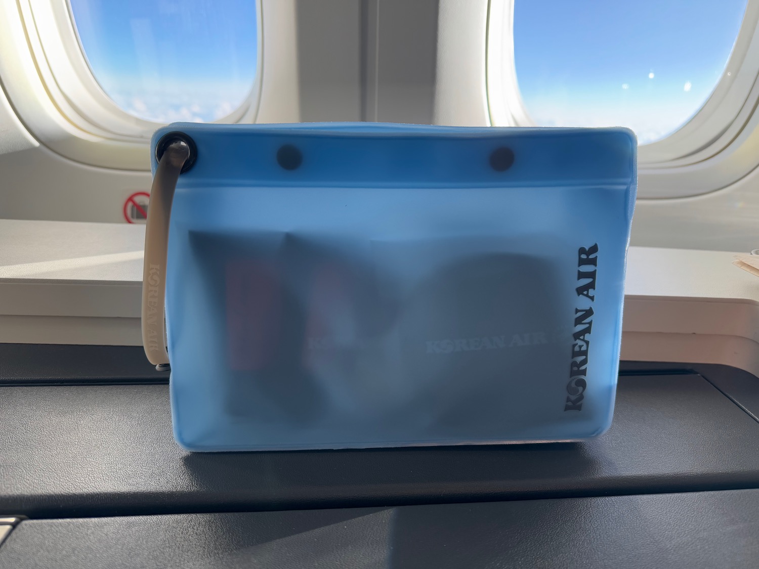 a blue bag on a window sill