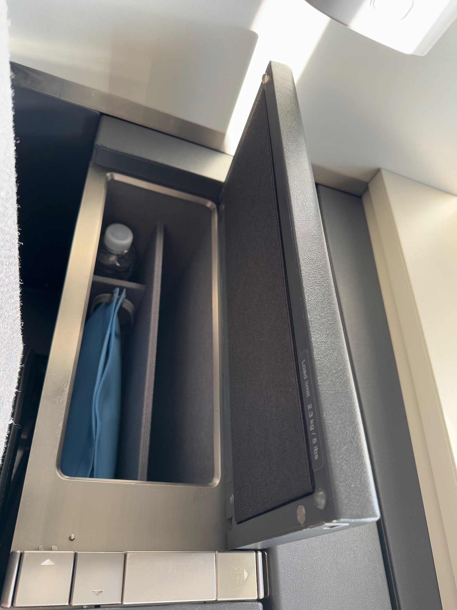 a small metal box with a door open
