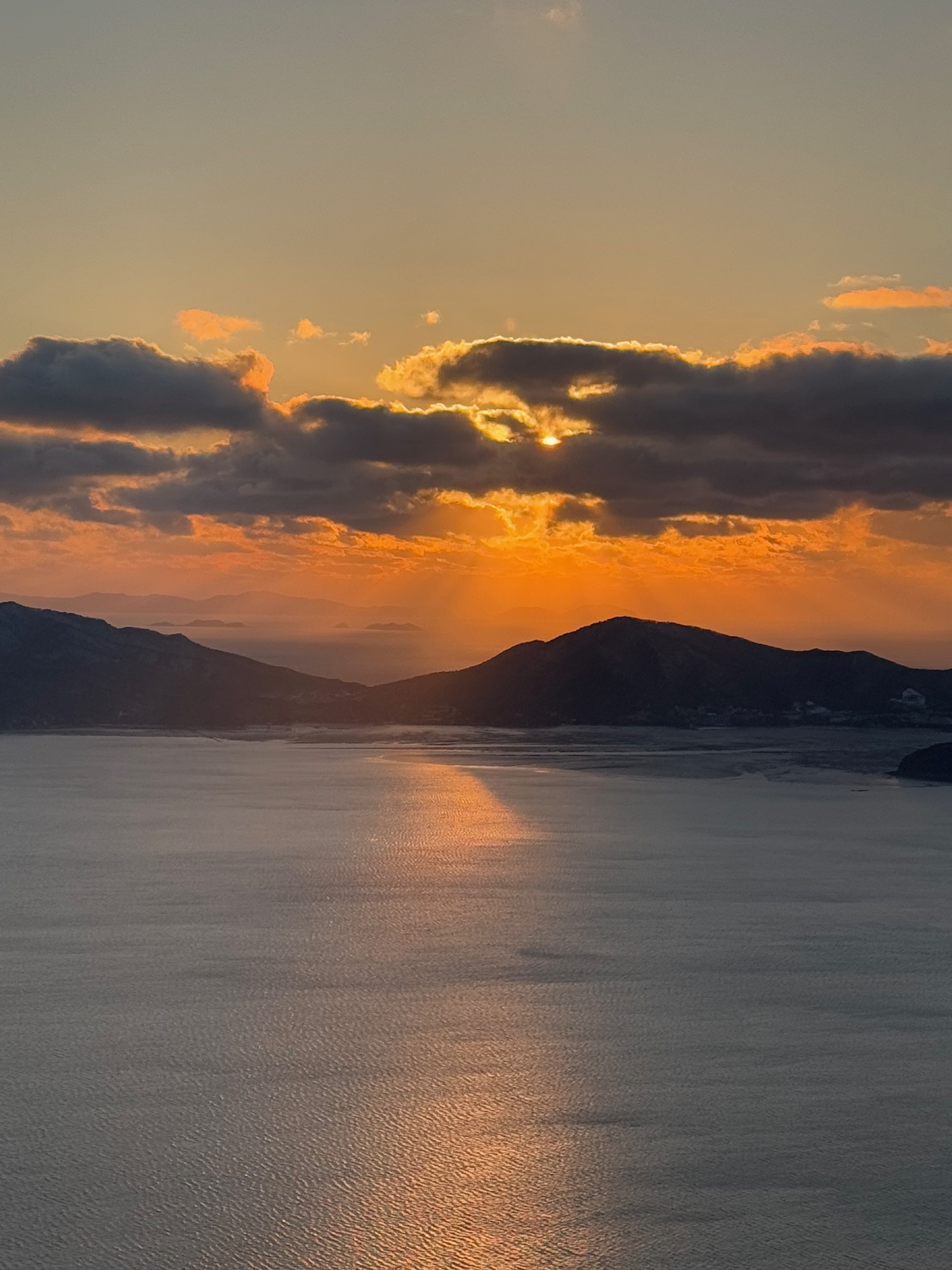 a sunset over a body of water
