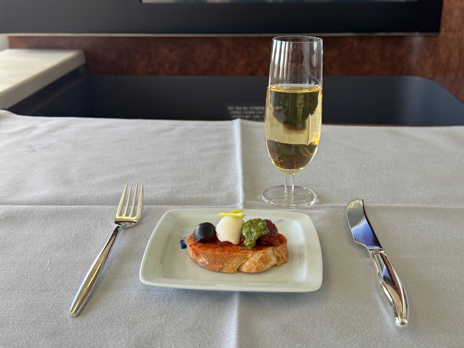 a plate of food and a glass of wine