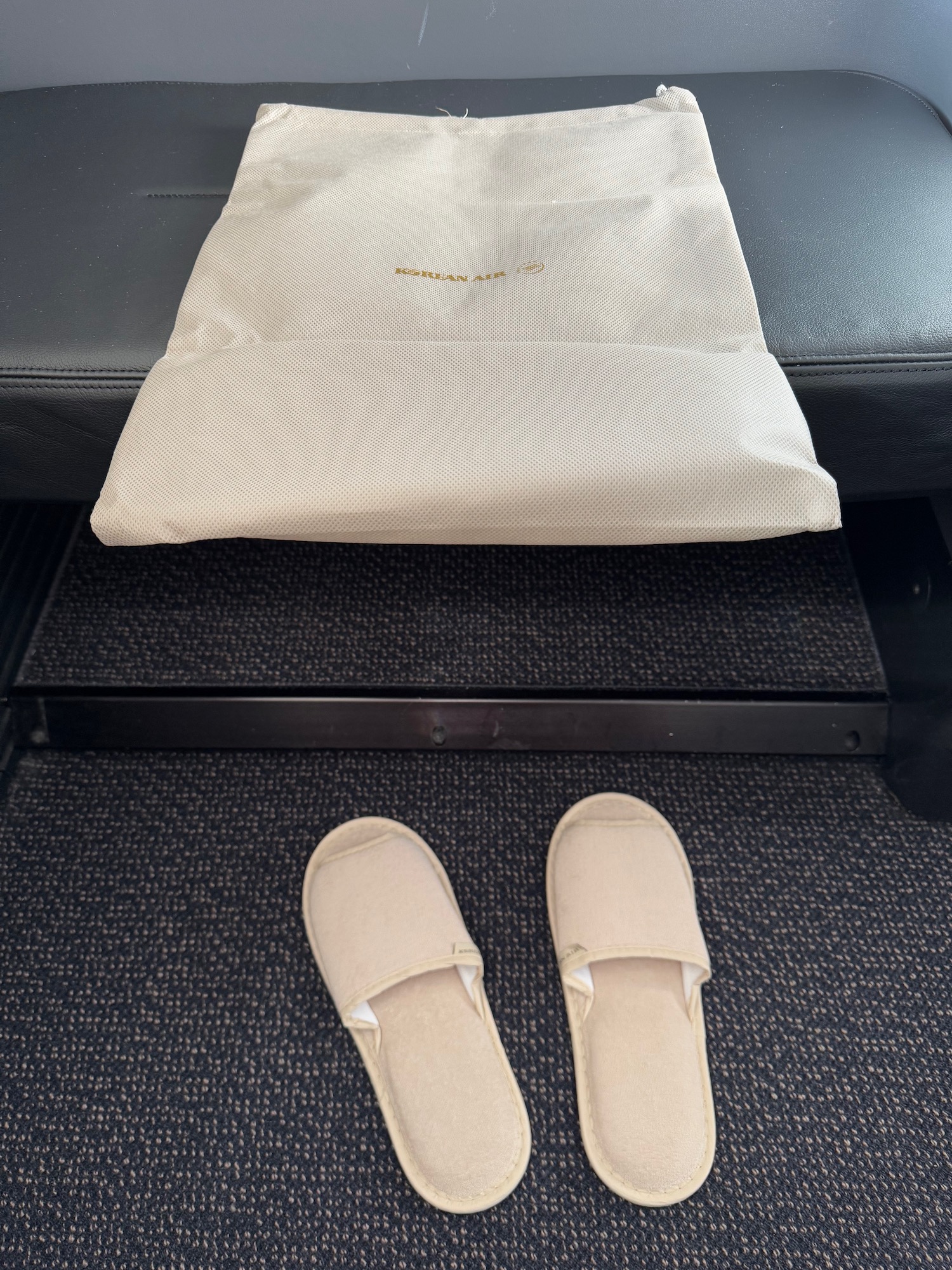 a pair of slippers on a black surface