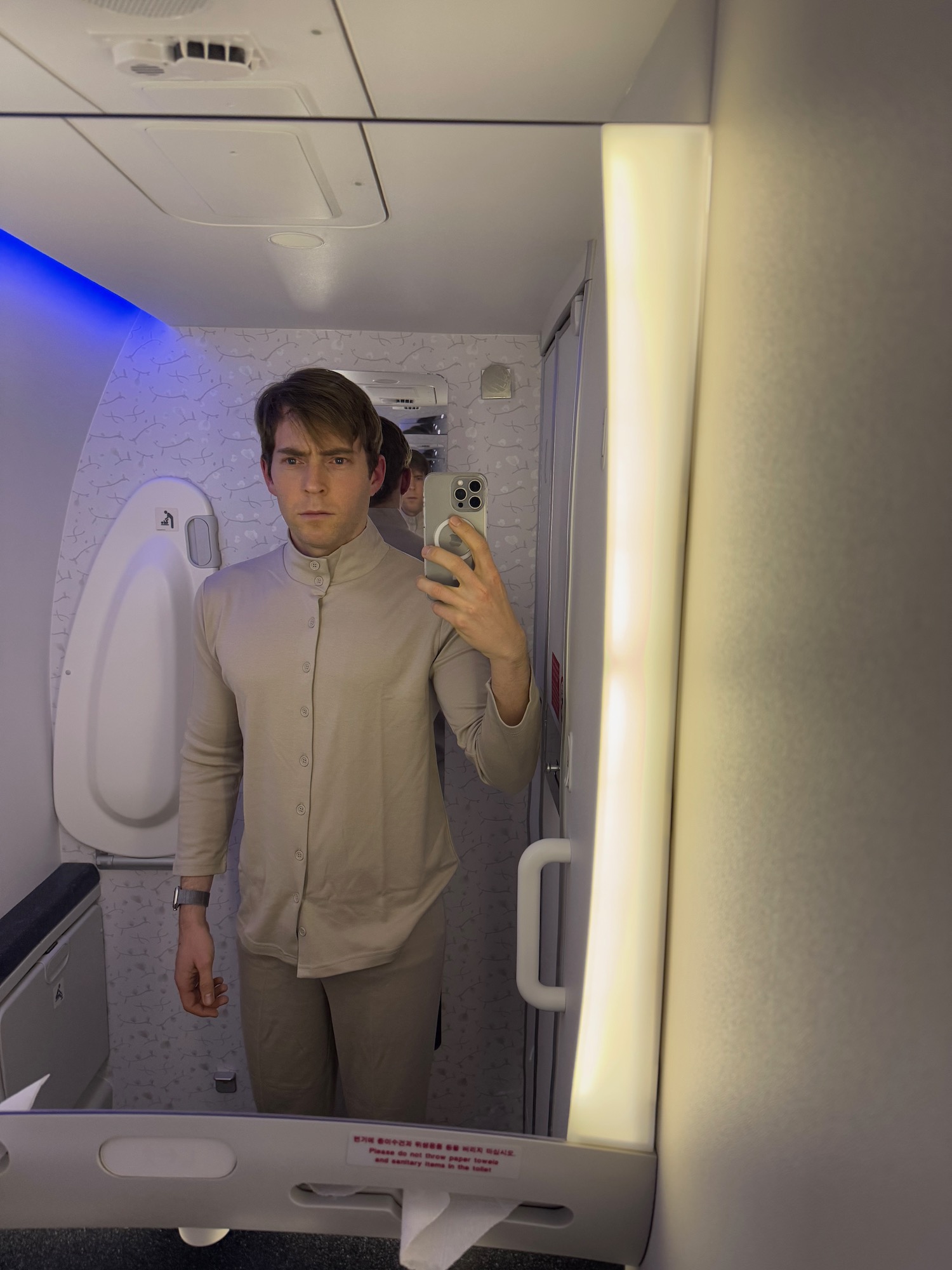 a man taking a selfie in a bathroom