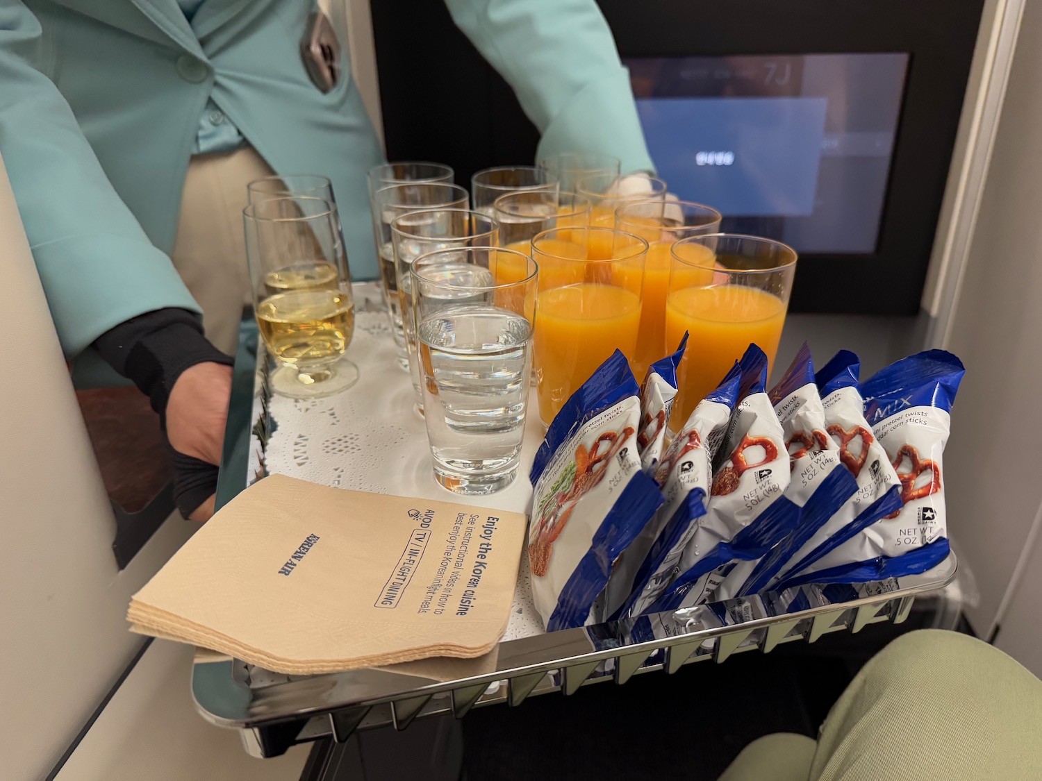 a tray of drinks and snacks