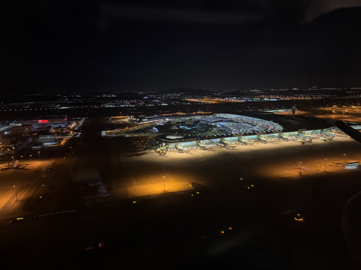 an aerial view of a large airport at night