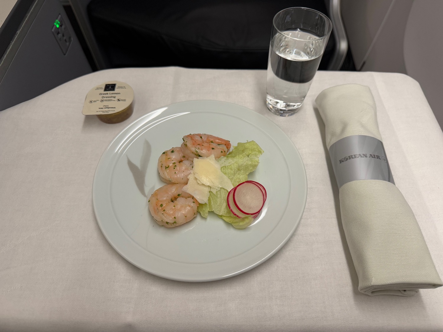 a plate of food and a napkin on a table