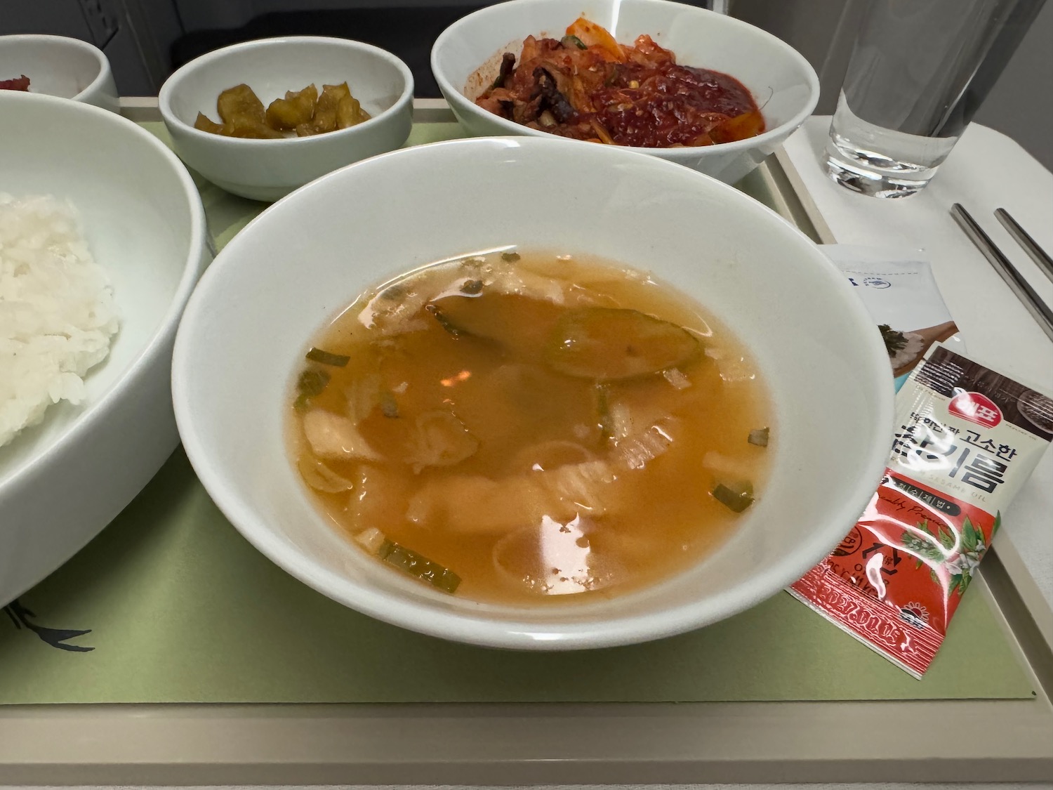 a bowl of soup and some bowls of food