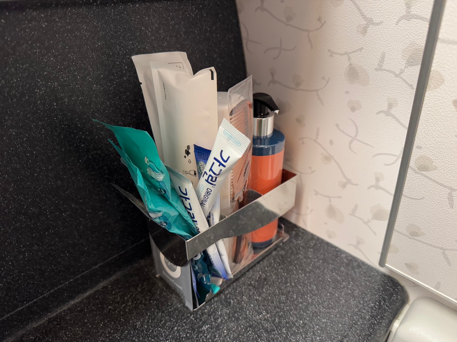 a metal container with various items in it