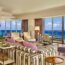 a living room with a view of the ocean