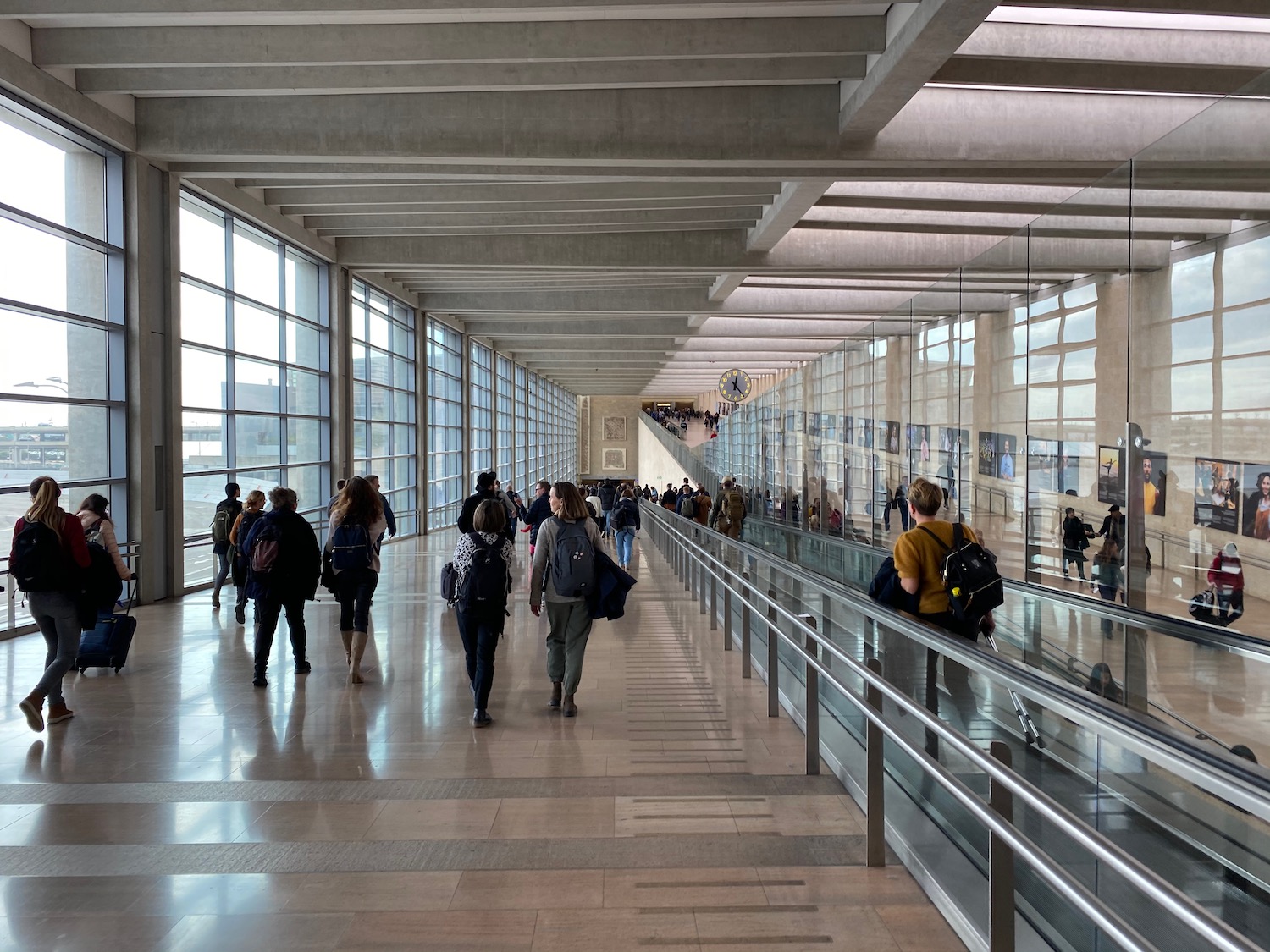 a group of people walking in a building