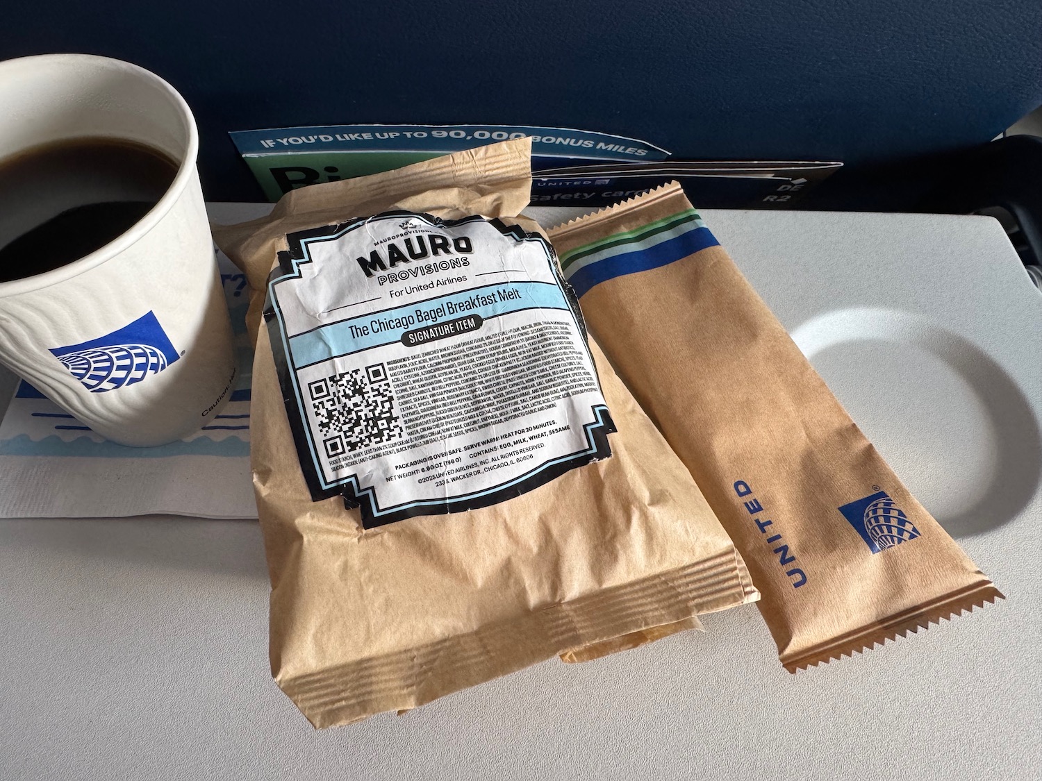 a coffee and a packet on a table