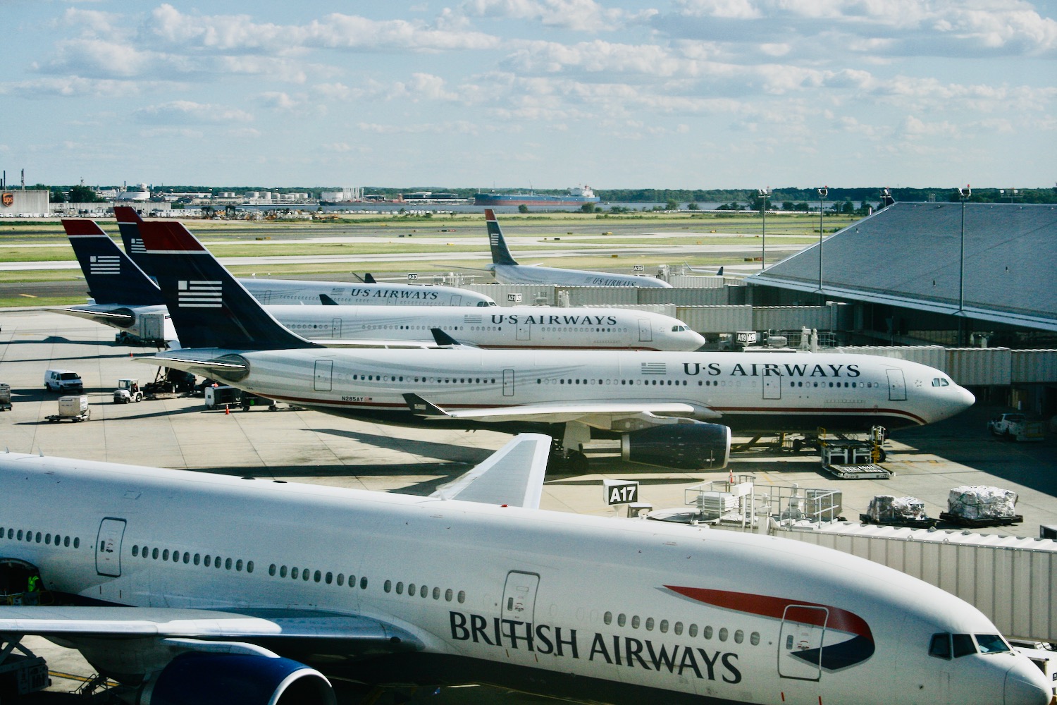 a group of airplanes at an airport