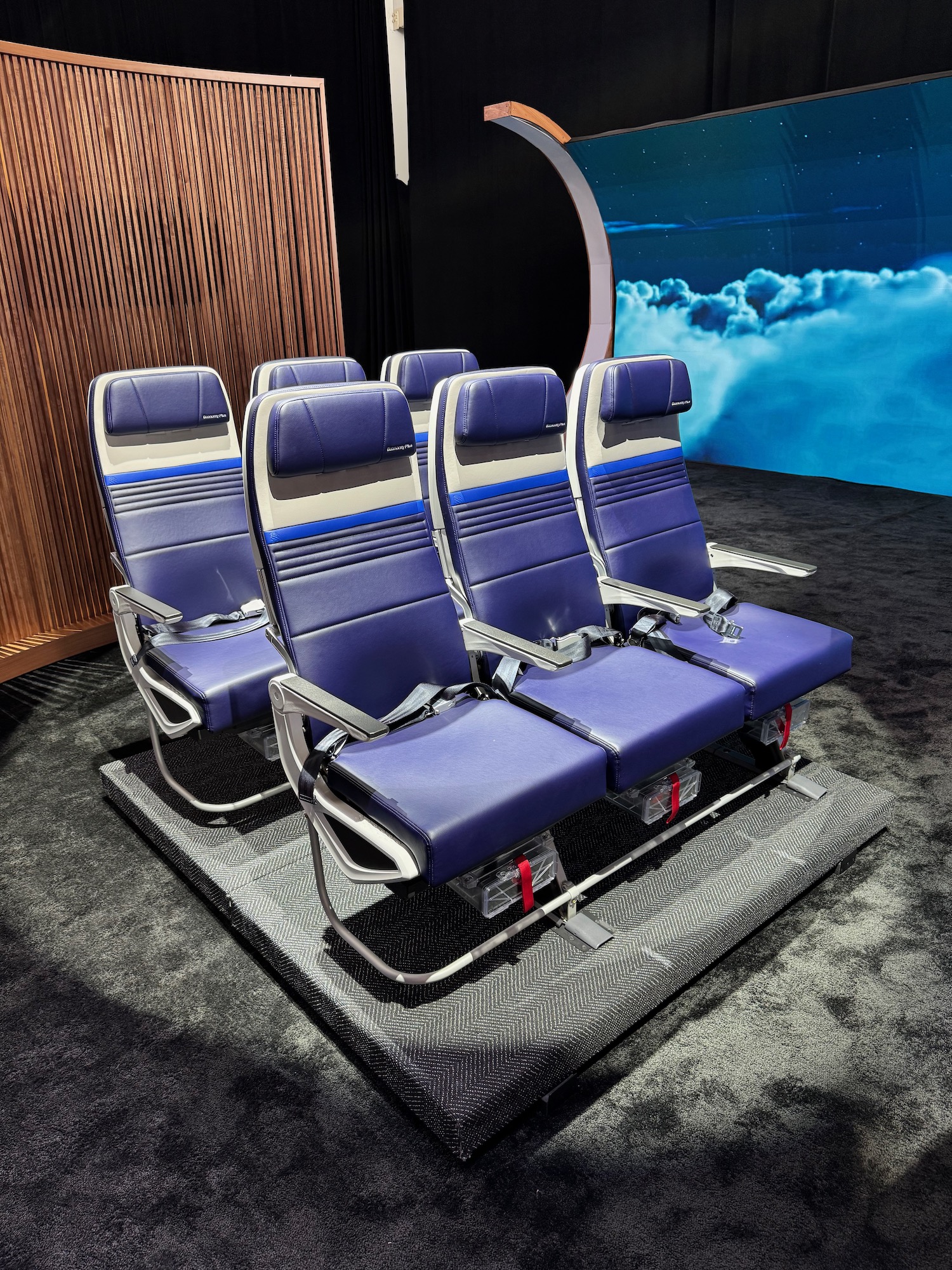 a row of blue chairs in a room