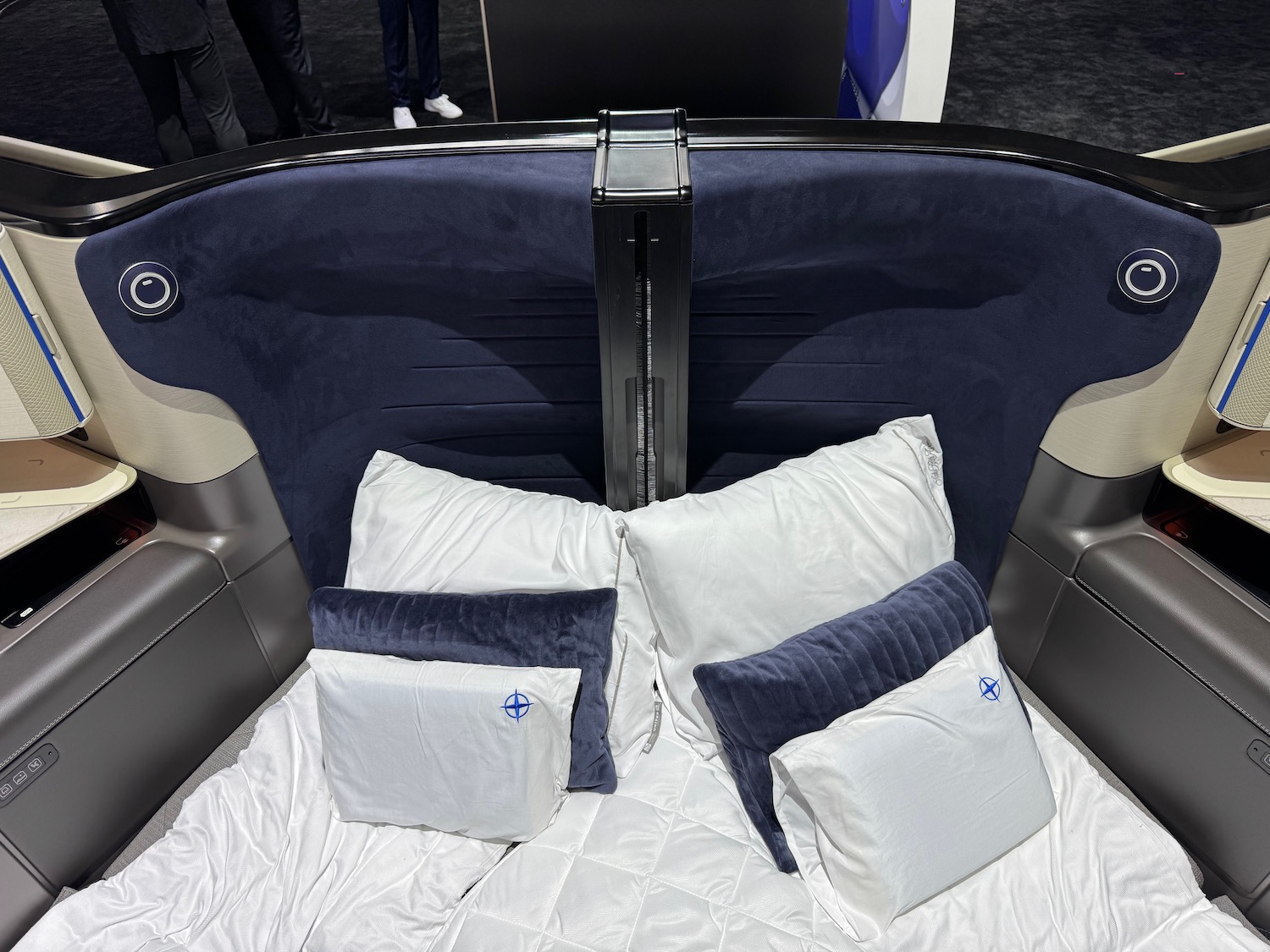 a bed with pillows and a pillow on it
