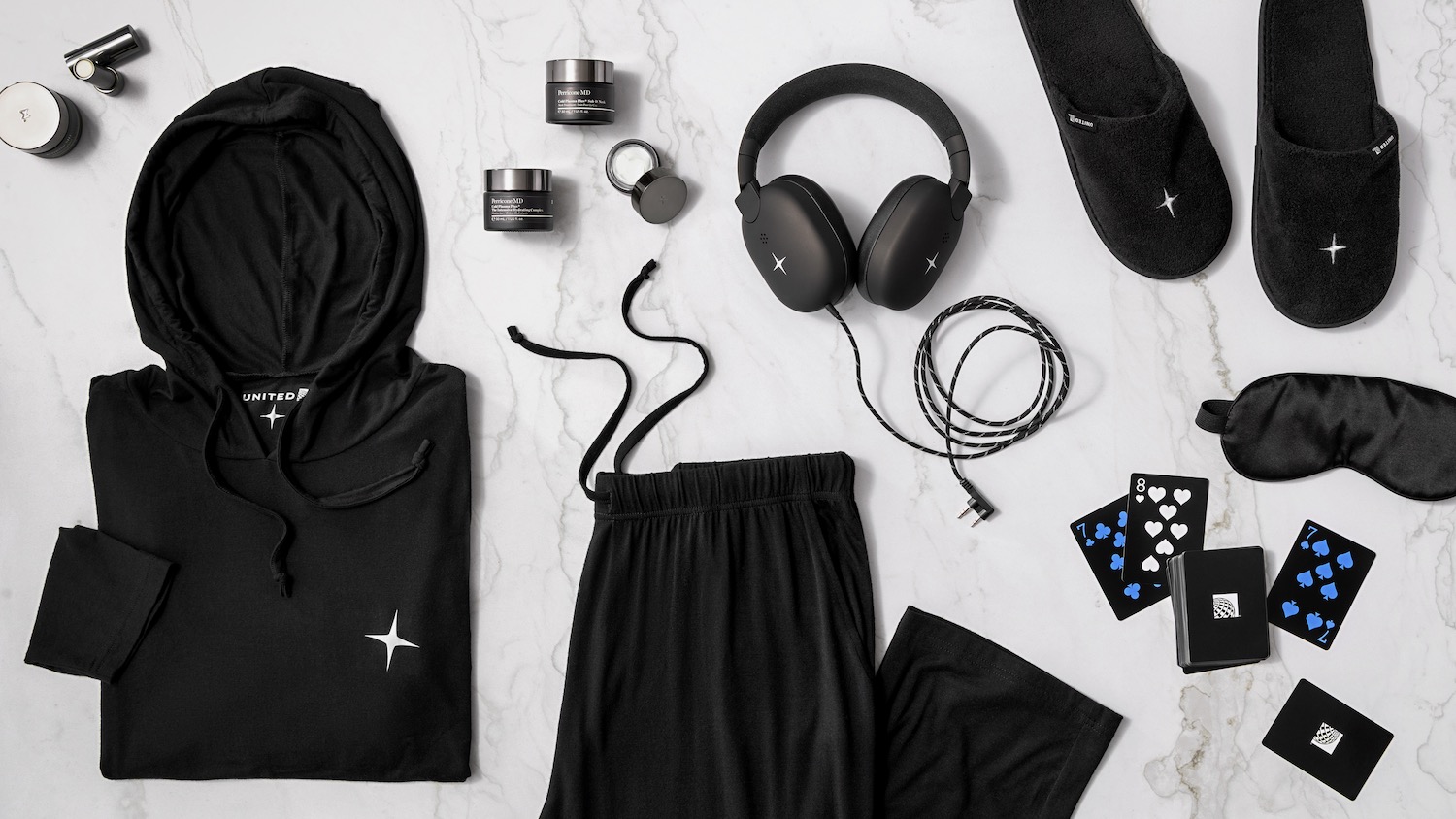 a black outfit and headphones