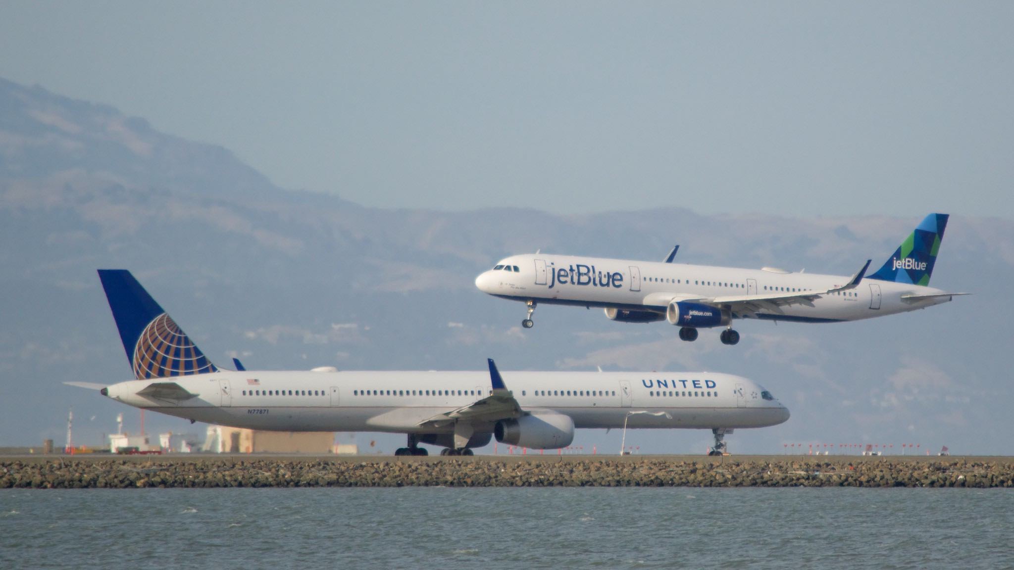 two airplanes on a runway