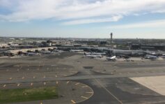an airport with airplanes on the runway