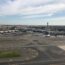 an airport with airplanes on the runway