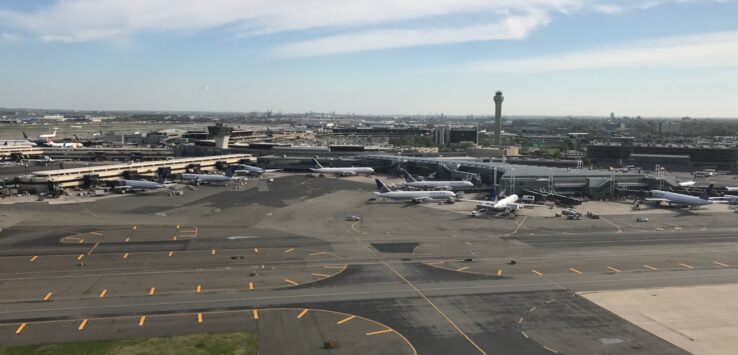 an airport with airplanes on the runway