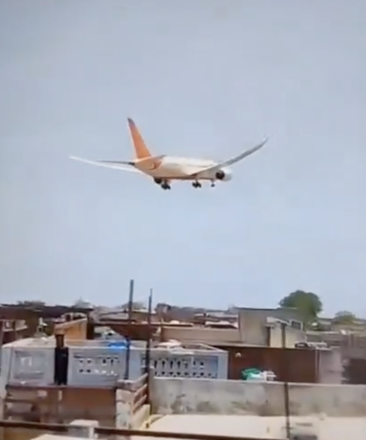 an airplane flying over a building