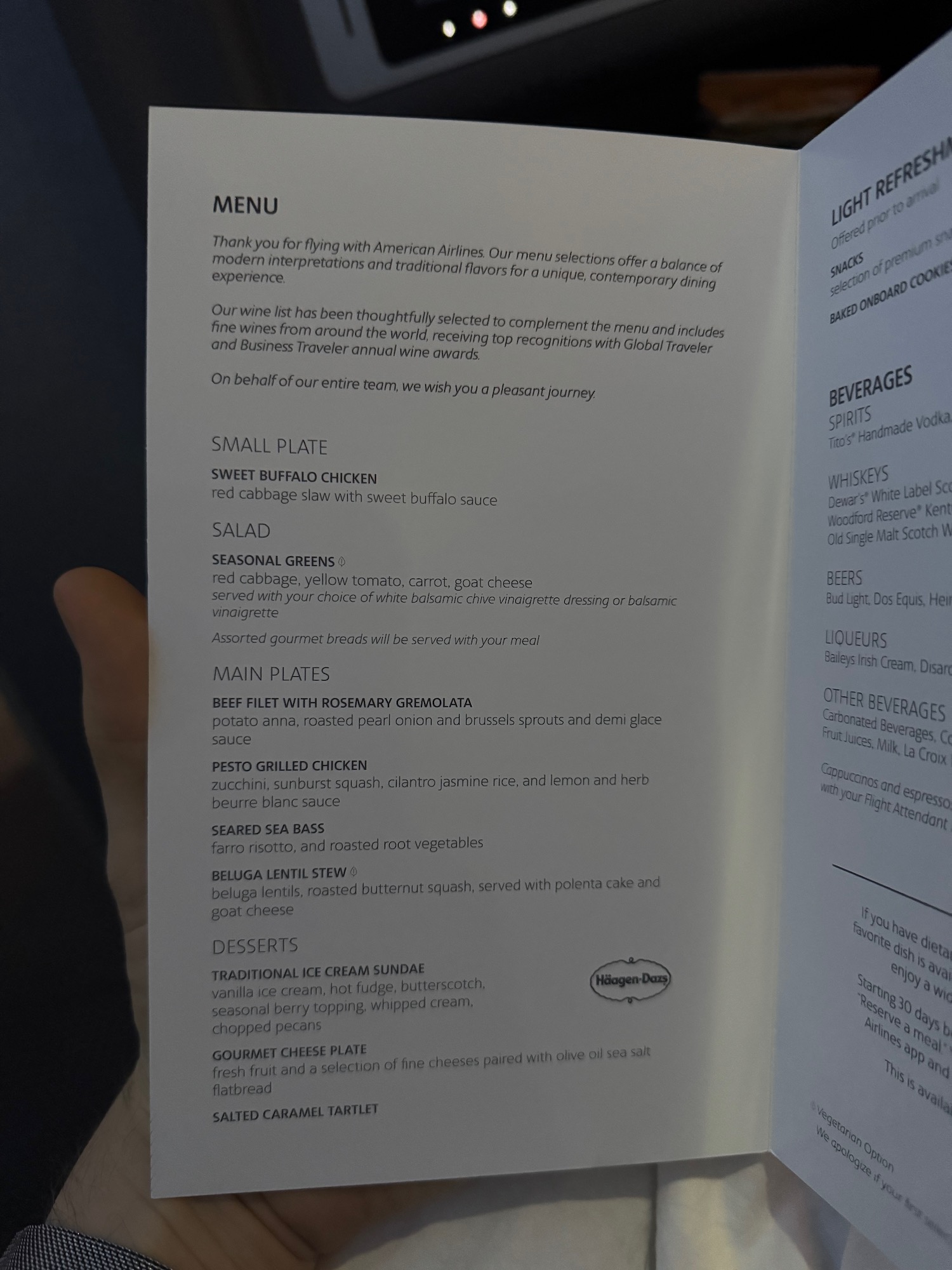 a hand holding a menu