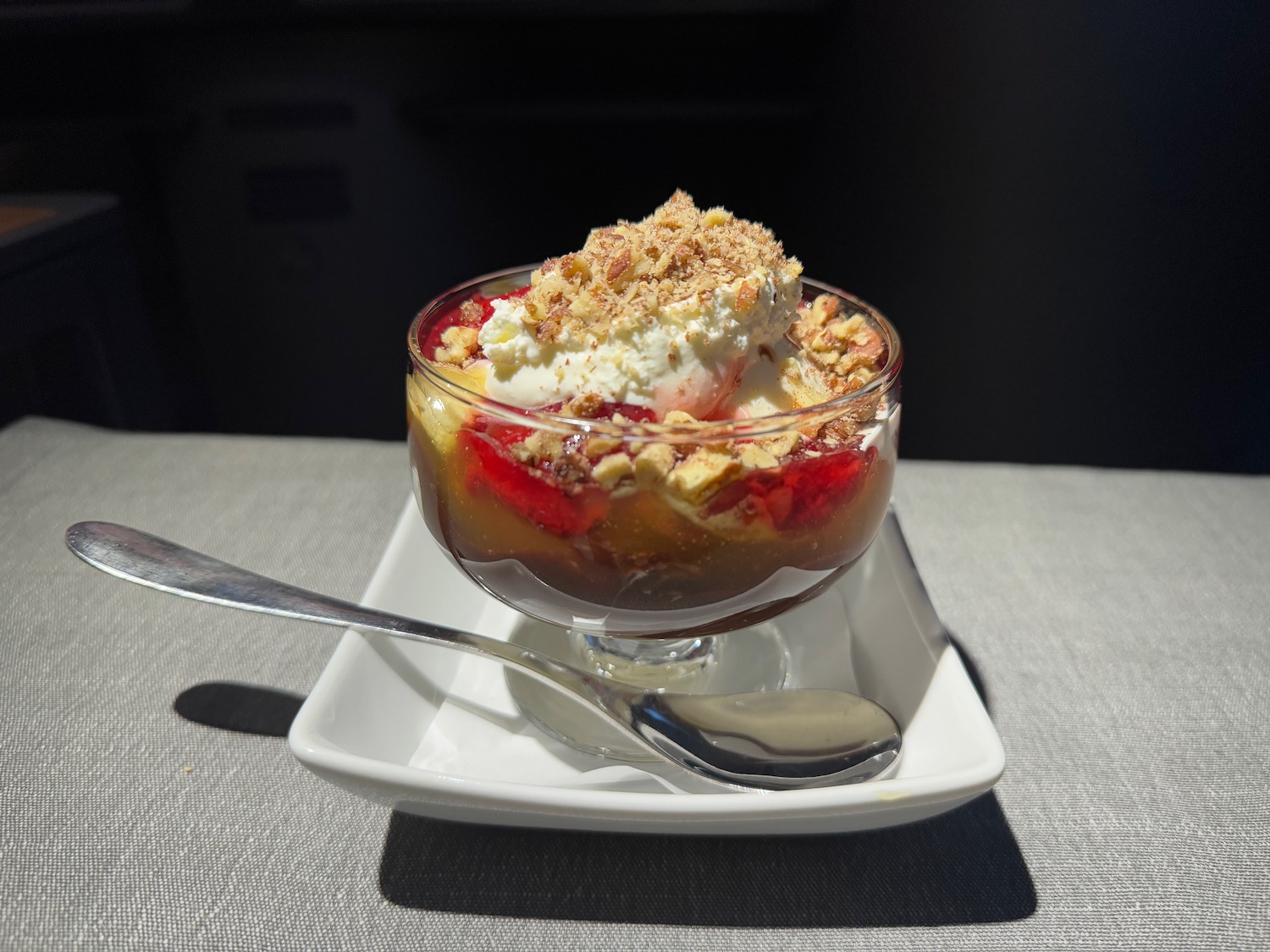 a dessert in a glass with a spoon