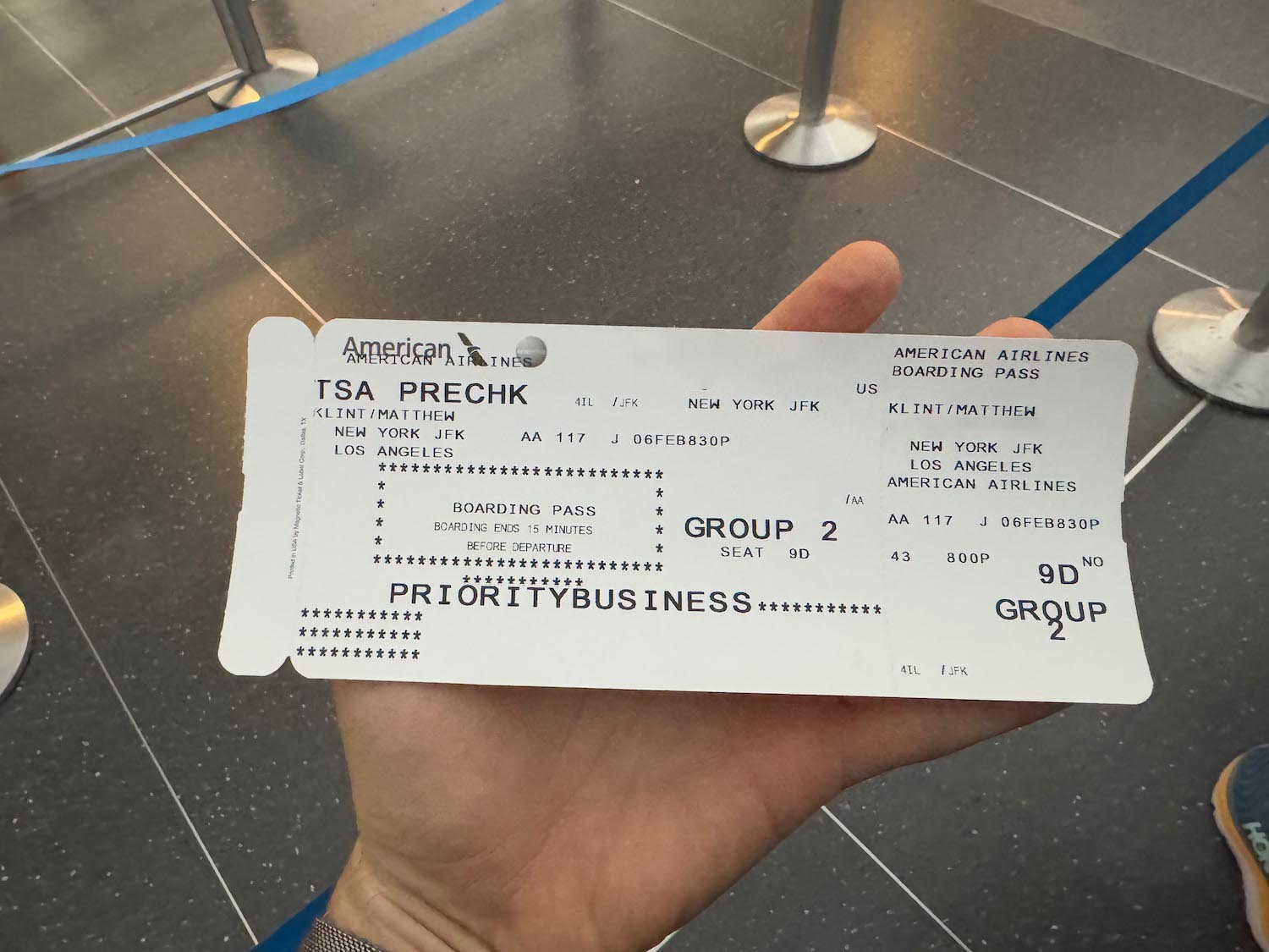 a hand holding a ticket