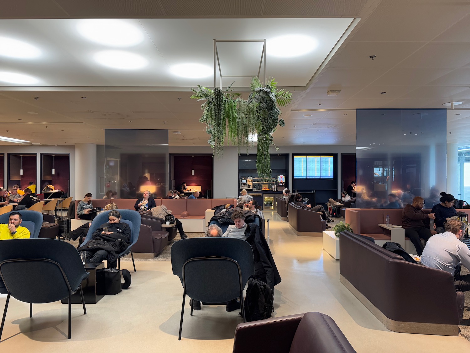 people sitting in chairs in a room