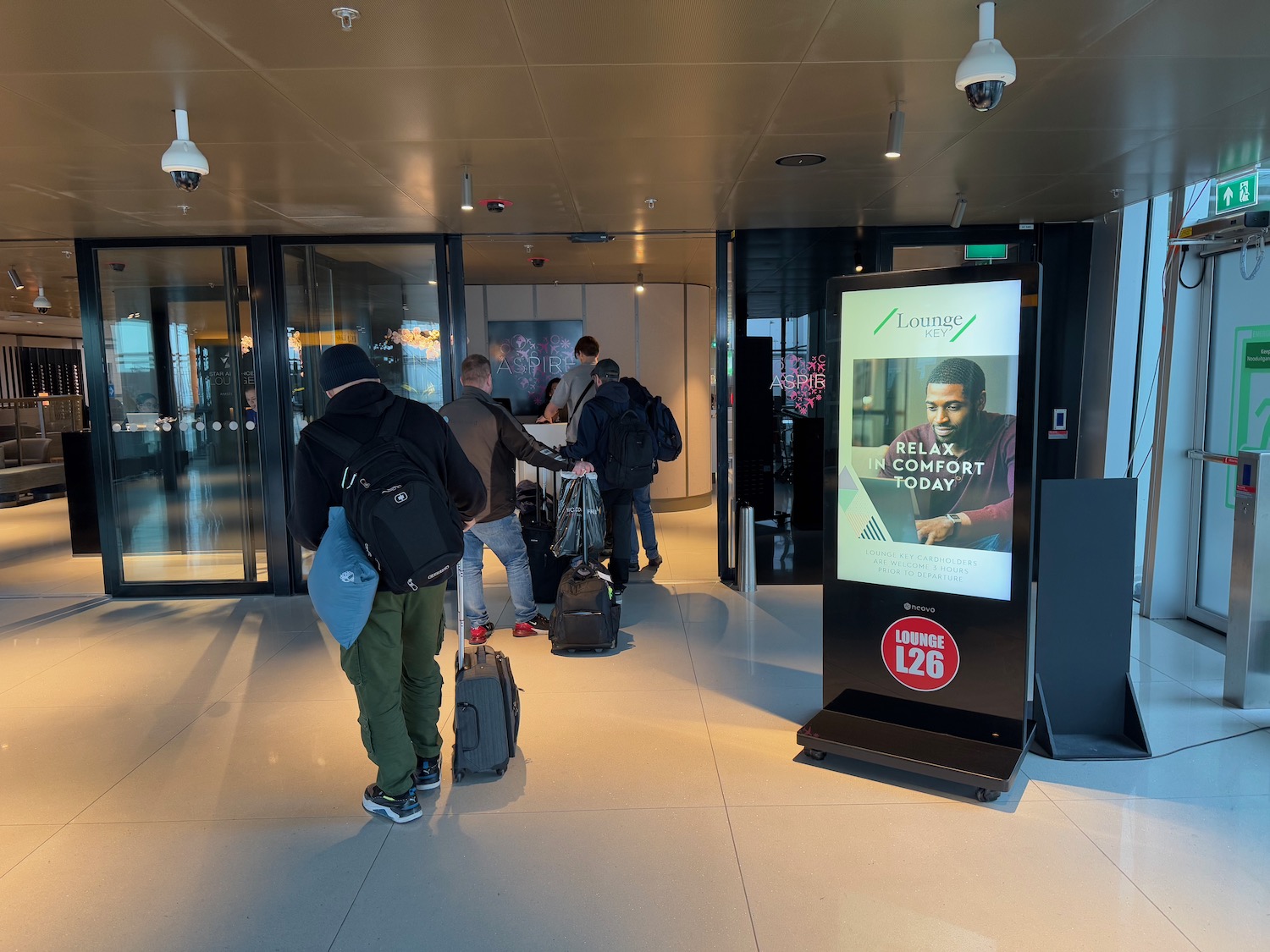 people standing in front of a sign