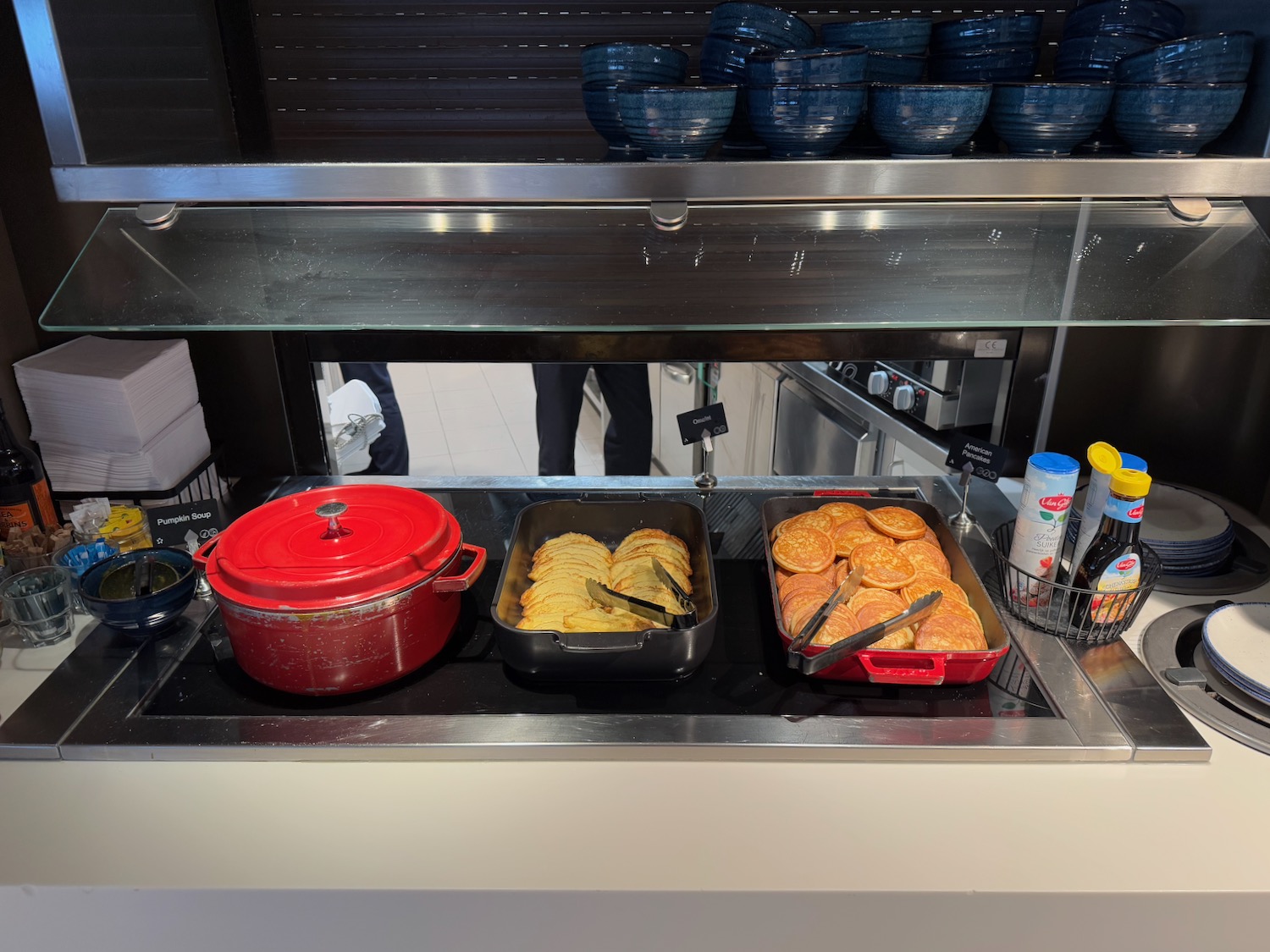 food on a counter with a glass shelf