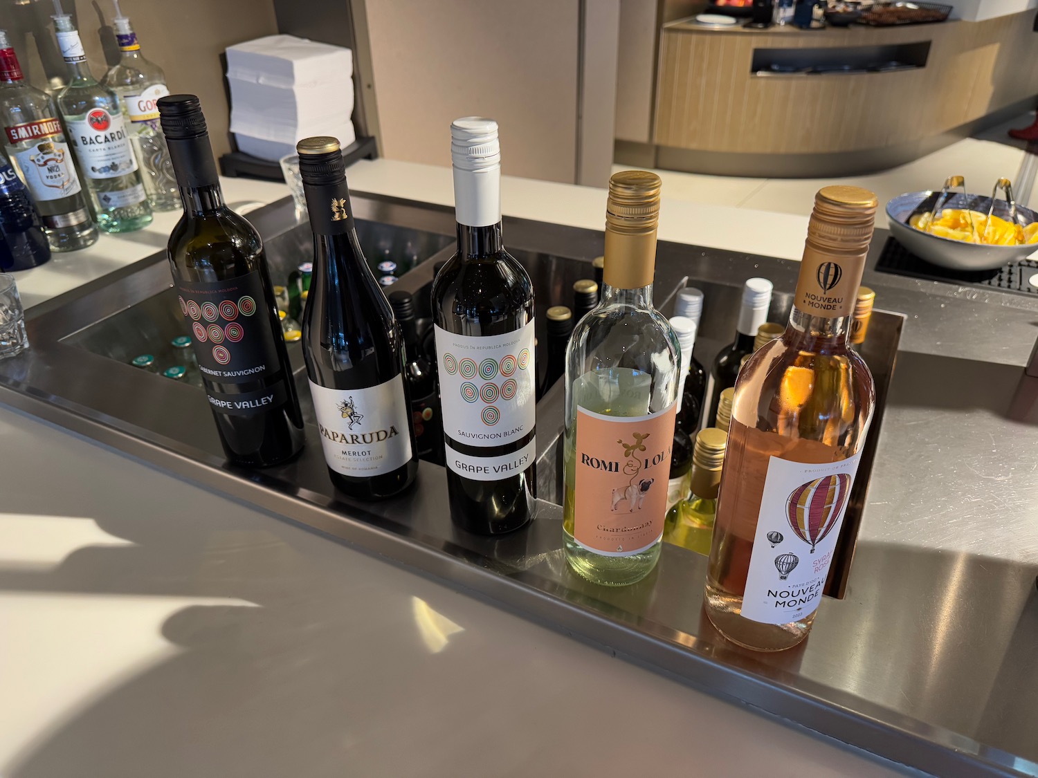 a group of bottles of wine on a counter