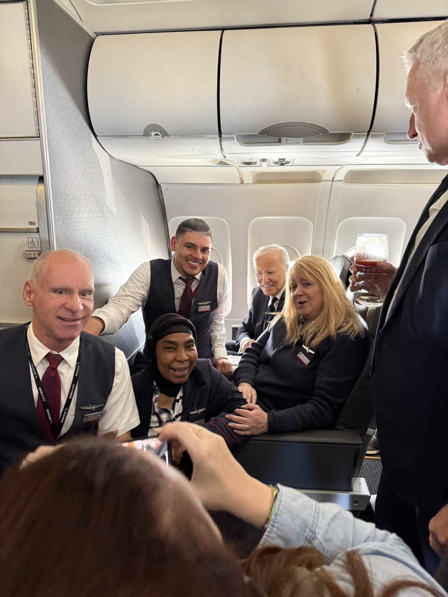 a group of people sitting in an airplane