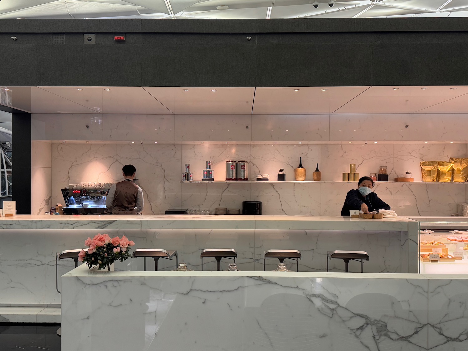people at a counter in a restaurant