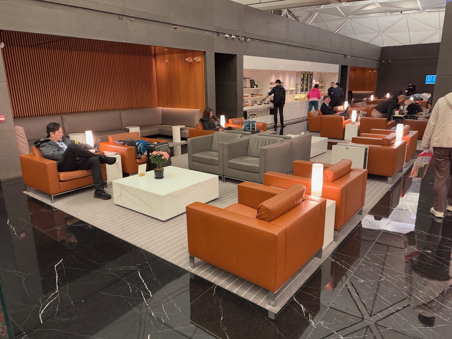 a group of people sitting in a lounge area