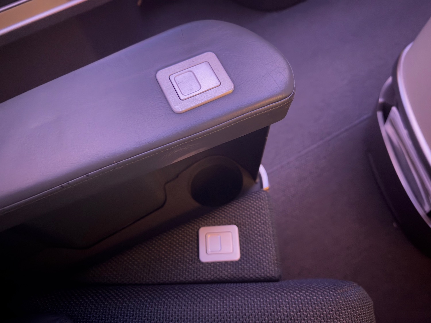 a armrest with square buttons on it